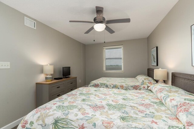 1903 S Ocean Blvd S Unit 808, North Myrtle Beach, SC 29582 - bedroom featuring ceiling fan and baseboards