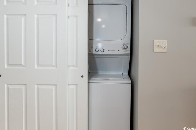 1903 S Ocean Blvd S Unit 808, North Myrtle Beach, SC 29582 - washroom featuring stacked washer / dryer