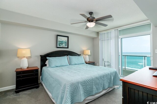 1903 S Ocean Blvd S Unit 808, North Myrtle Beach, SC 29582 - bedroom featuring carpet, access to outside, a water view, a ceiling fan, and a textured ceiling