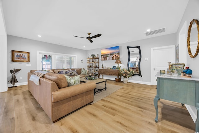 living area with a ceiling fan, light wood finished floors, recessed lighting, and baseboards