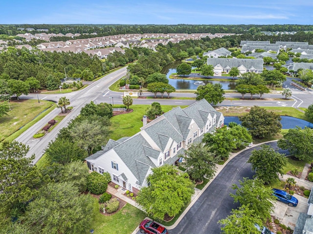 aerial view of residential area featuring a nearby body of water