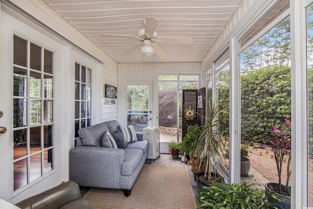 sunroom with a ceiling fan