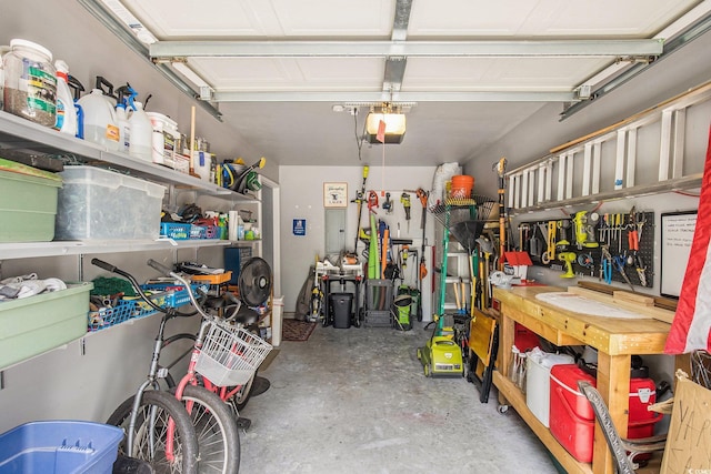 garage featuring a workshop area and a garage door opener