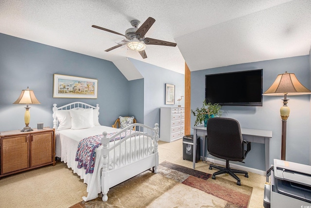 carpeted bedroom with lofted ceiling, a textured ceiling, ceiling fan, and an office area