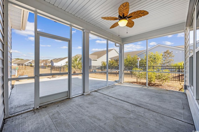 692 Cherry Blossom Dr, Murrells Inlet, SC 29576 - unfurnished sunroom featuring a ceiling fan, plenty of natural light, and a residential view