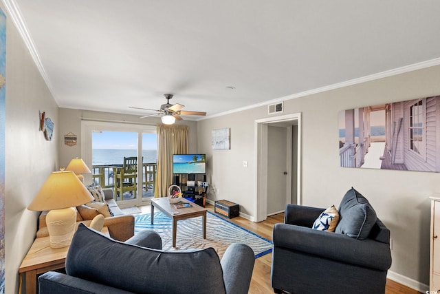 1310 N Waccamaw Dr Unit 204, Garden City Beach, SC 29576 - living area with crown molding, light wood-type flooring, ceiling fan, and baseboards