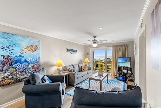 1310 N Waccamaw Dr Unit 204, Garden City Beach, SC 29576 - living room featuring light wood-style flooring, crown molding, ceiling fan, and baseboards