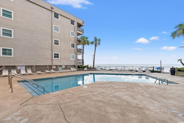 1310 N Waccamaw Dr Unit 204, Garden City Beach, SC 29576 - community pool with fence and a patio area