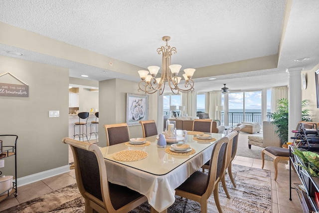 3805 S Ocean Blvd # 503, North Myrtle Beach, SC 29582 - dining area with a textured ceiling, decorative columns, a chandelier, baseboards, and light tile patterned flooring