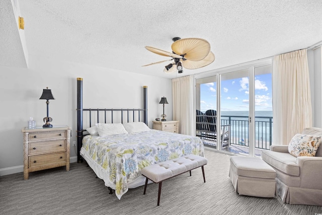 3805 S Ocean Blvd # 503, North Myrtle Beach, SC 29582 - bedroom featuring access to outside, a textured ceiling, a water view, carpet flooring, and ceiling fan
