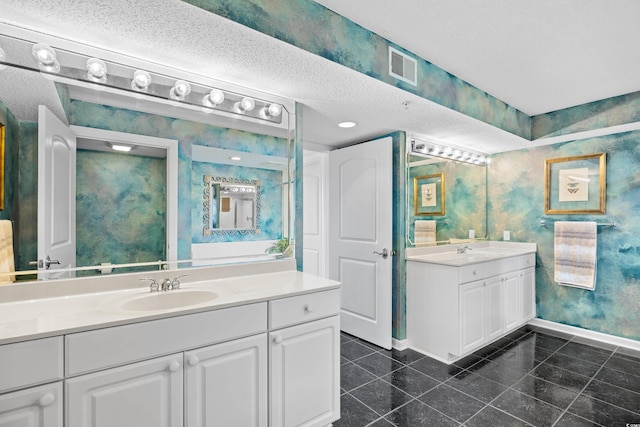 3805 S Ocean Blvd # 503, North Myrtle Beach, SC 29582 - bathroom featuring wallpapered walls, baseboards, and two vanities