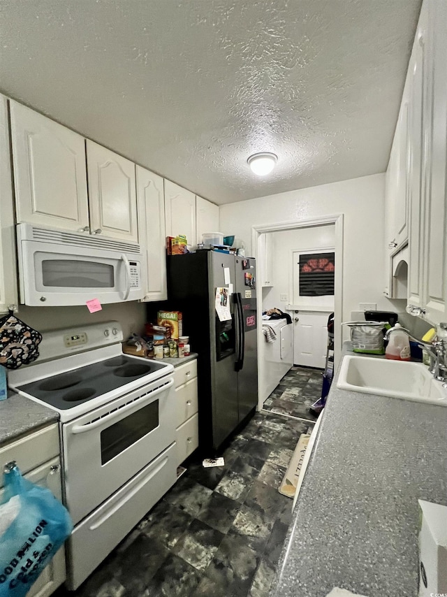 755 Burcale Rd Unit G4, Myrtle Beach, SC 29579 - kitchen with white appliances, a sink, white cabinets, dark flooring, and a textured ceiling