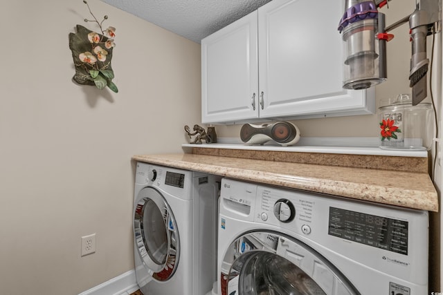 2241 Waterview Dr Unit 537, North Myrtle Beach, SC 29582 - clothes washing area featuring cabinet space, independent washer and dryer, a textured ceiling, and baseboards
