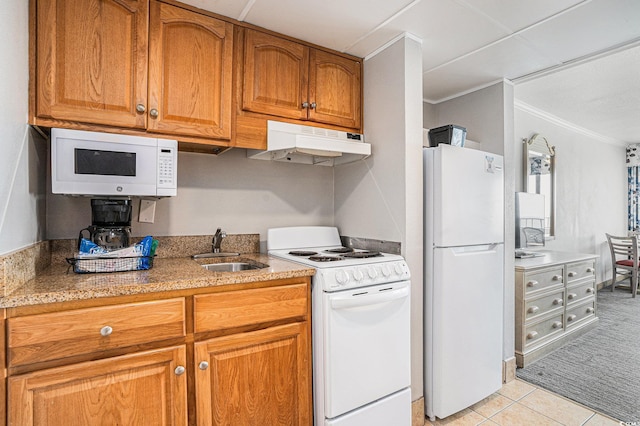 7100 N Ocean Blvd N Unit 1011, Myrtle Beach, SC 29572 - kitchen featuring white appliances, under cabinet range hood, a sink, ornamental molding, and brown cabinetry