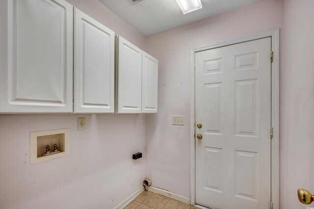 638 Hatteras River Rd, Myrtle Beach, SC 29588 - laundry area with cabinet space, electric dryer hookup, washer hookup, baseboards, and light tile patterned floors