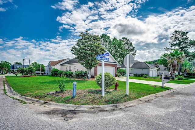 638 Hatteras River Rd, Myrtle Beach, SC 29588 - view of front facade featuring driveway, a garage, a front yard, and a residential view