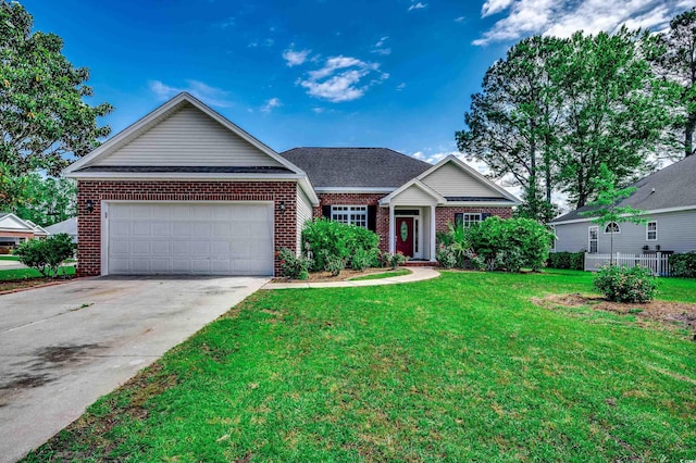 638 Hatteras River Rd, Myrtle Beach, SC 29588 - view of front of home featuring brick siding, a garage, driveway, and a front lawn