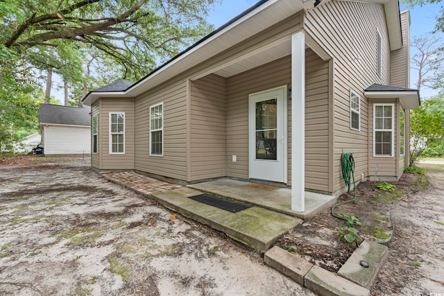 property entrance with a patio area