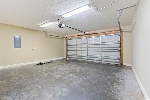 garage featuring a garage door opener, electric panel, and baseboards