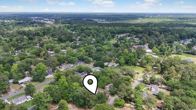 aerial perspective of suburban area with a heavily wooded area
