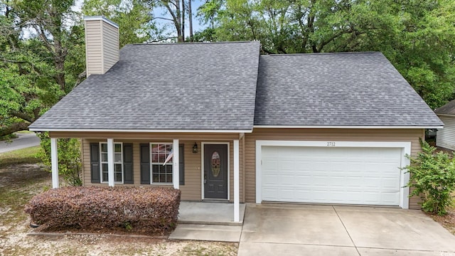 view of front facade featuring a shingled roof, a chimney, a garage, covered porch, and concrete driveway