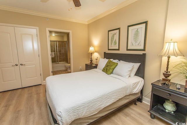 100 N Beach Blvd Unit 1902, North Myrtle Beach, SC 29582 - bedroom featuring wood finished floors, ensuite bath, a closet, ornamental molding, and baseboards