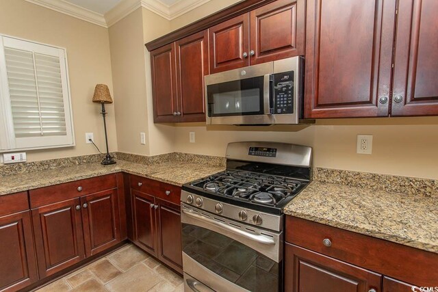 100 N Beach Blvd Unit 1902, North Myrtle Beach, SC 29582 - kitchen with appliances with stainless steel finishes, dark brown cabinets, ornamental molding, and light stone countertops