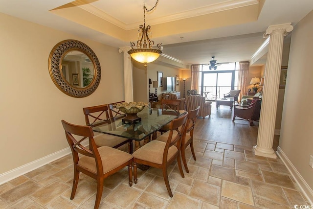 100 N Beach Blvd Unit 1902, North Myrtle Beach, SC 29582 - dining space featuring ornate columns, ornamental molding, stone tile floors, ceiling fan, and a raised ceiling