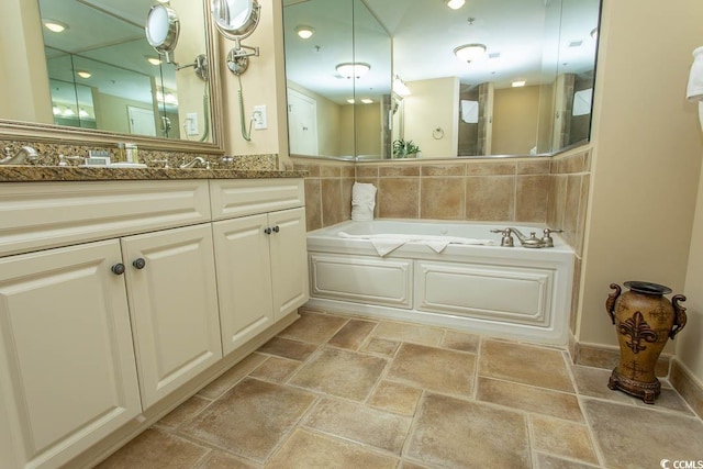 100 N Beach Blvd Unit 1902, North Myrtle Beach, SC 29582 - full bathroom with a garden tub, vanity, and stone finish floors