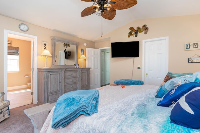carpeted bedroom with lofted ceiling, ensuite bath, and a ceiling fan