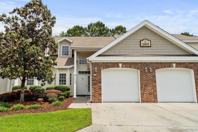 160 Cart Crossing Dr Unit 104, Conway, SC 29526 - view of front facade with driveway, an attached garage, brick siding, and a shingled roof
