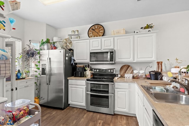 160 Cart Crossing Dr Unit 104, Conway, SC 29526 - kitchen with appliances with stainless steel finishes, a sink, dark wood-type flooring, and white cabinets