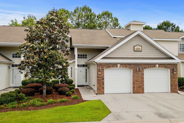 160 Cart Crossing Dr Unit 104, Conway, SC 29526 - view of front facade featuring driveway, a garage, brick siding, and roof with shingles