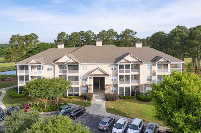 260 Woodlands Way Unit 2, Calabash, NC 28467 - view of building exterior featuring uncovered parking and a water view
