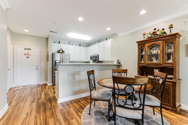 260 Woodlands Way Unit 2, Calabash, NC 28467 - dining area featuring light wood finished floors, recessed lighting, baseboards, and ornamental molding