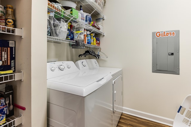 260 Woodlands Way Unit 2, Calabash, NC 28467 - clothes washing area featuring electric panel, washing machine and clothes dryer, wood finished floors, and baseboards