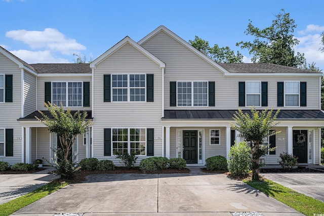 1196 Harvester Cir Unit 1196, Myrtle Beach, SC 29579 - view of property with a standing seam roof, metal roof, and a porch