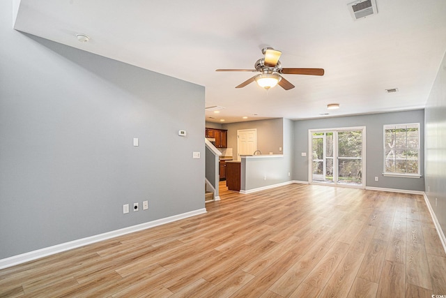 1196 Harvester Cir Unit 1196, Myrtle Beach, SC 29579 - unfurnished living room with light wood-style floors, baseboards, ceiling fan, stairway, and recessed lighting