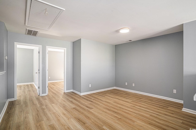 1196 Harvester Cir Unit 1196, Myrtle Beach, SC 29579 - spare room featuring attic access, light wood finished floors, and baseboards
