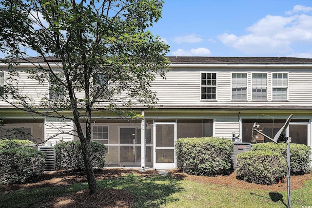 1196 Harvester Cir Unit 1196, Myrtle Beach, SC 29579 - rear view of house featuring a sunroom, a lawn, and a shingled roof