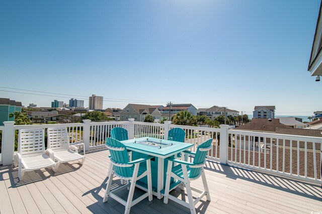 163 Cypress Ave, Murrells Inlet, SC 29576 - wooden deck featuring outdoor dining area and a residential view