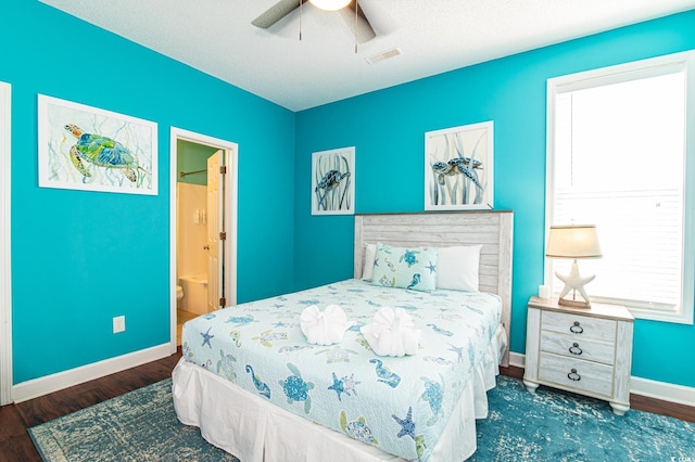 163 Cypress Ave, Murrells Inlet, SC 29576 - bedroom featuring wood finished floors, baseboards, ensuite bath, and ceiling fan