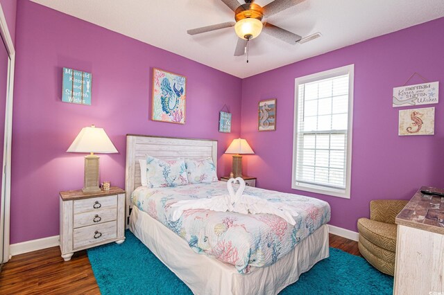 163 Cypress Ave, Murrells Inlet, SC 29576 - bedroom featuring dark wood-type flooring, baseboards, and ceiling fan