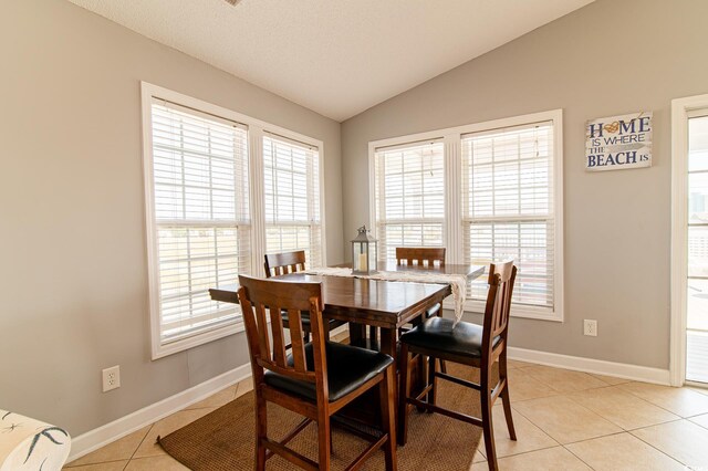 163 Cypress Ave, Murrells Inlet, SC 29576 - dining room featuring lofted ceiling, baseboards, and light tile patterned floors