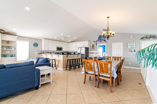 163 Cypress Ave, Murrells Inlet, SC 29576 - dining room with a chandelier, lofted ceiling, light tile patterned floors, recessed lighting, and baseboards