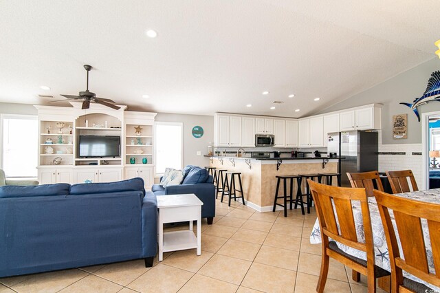 163 Cypress Ave, Murrells Inlet, SC 29576 - living area featuring light tile patterned floors, ceiling fan, recessed lighting, and lofted ceiling