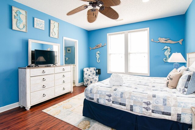 163 Cypress Ave, Murrells Inlet, SC 29576 - bedroom with dark wood-style floors, baseboards, a ceiling fan, and a textured ceiling