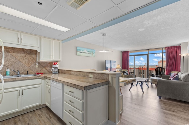 202 74th Ave N Unit 2547/2548, Myrtle Beach, SC 29572 - kitchen with tile countertops, open floor plan, dishwasher, a sink, and a peninsula