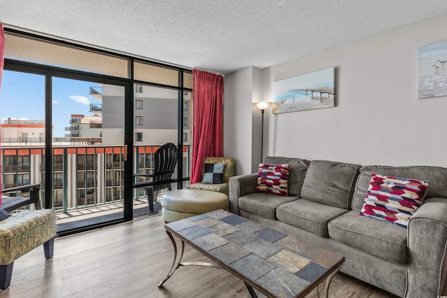 202 74th Ave N Unit 2547/2548, Myrtle Beach, SC 29572 - living area with floor to ceiling windows, wood finished floors, a textured ceiling, and a view of city