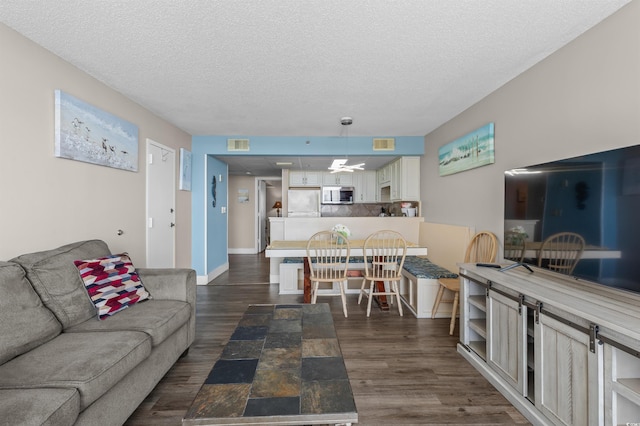 202 74th Ave N Unit 2547/2548, Myrtle Beach, SC 29572 - living room with dark wood finished floors and a textured ceiling